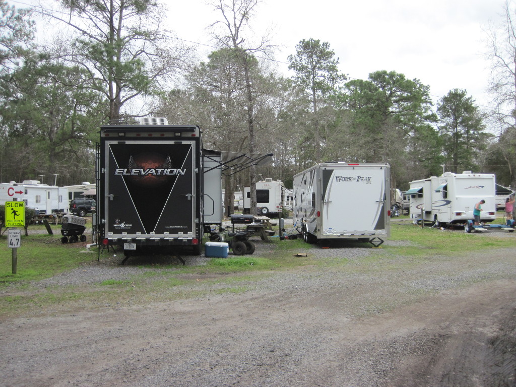 Trailer next to a Huge 5th Wheel